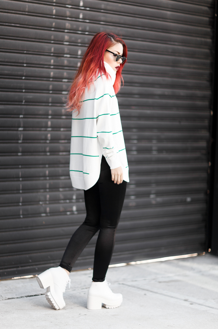 Le Happy wearing Melissa shoes and striped turtleneck