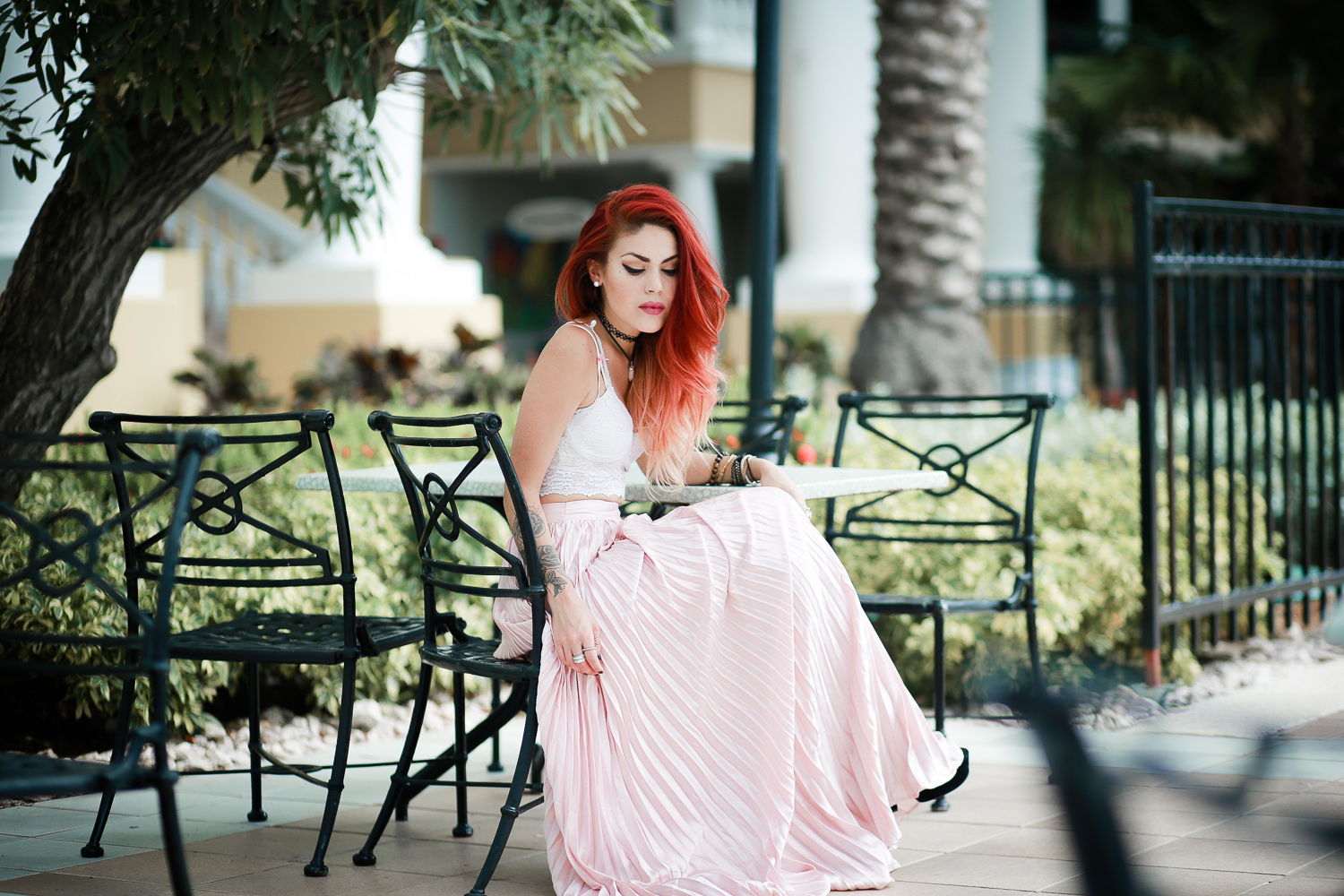 Le Happy wearing pastel pleated skirt on Curacao