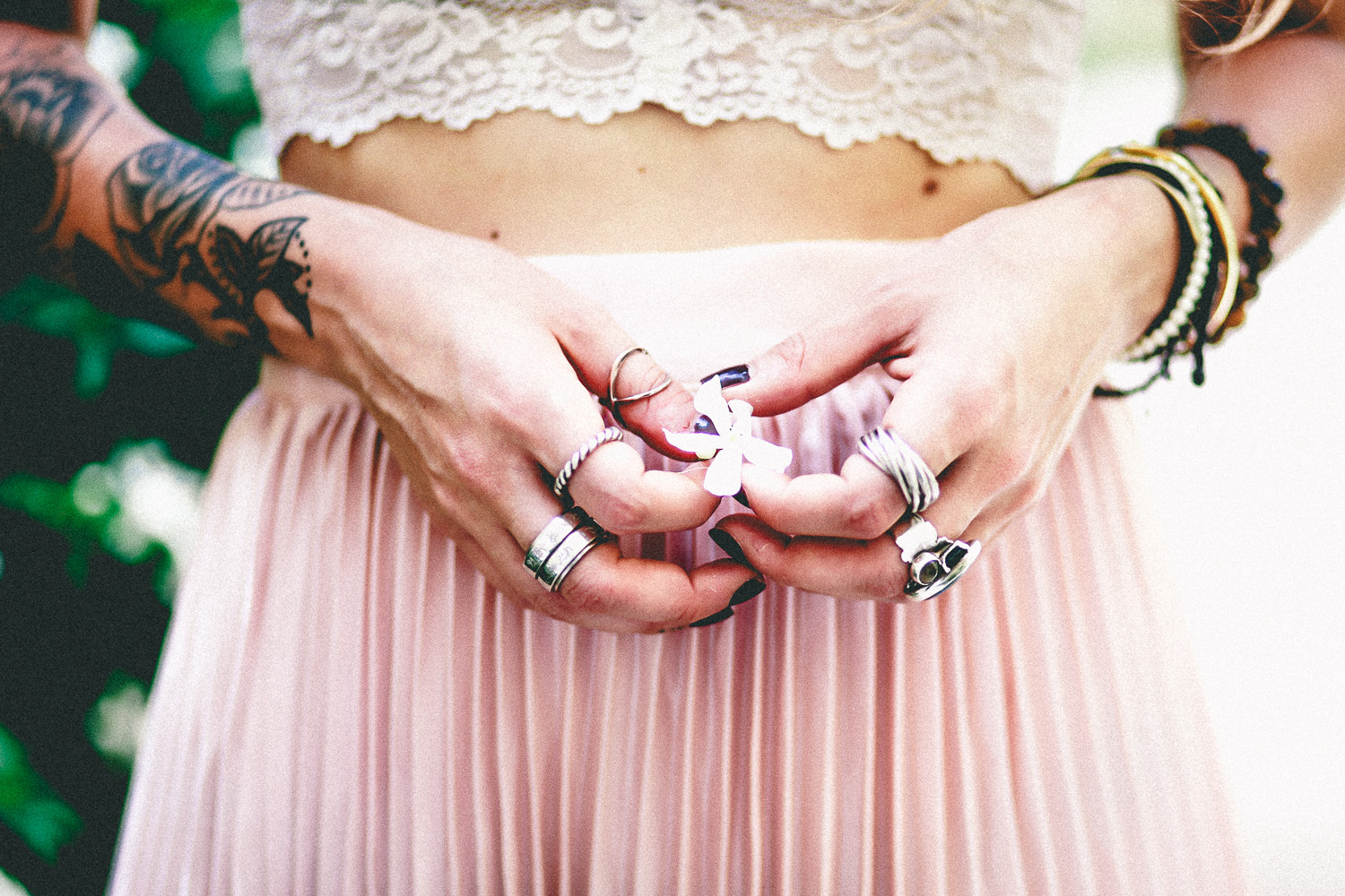 Le Happy wearing pleated skirt in pastel pink
