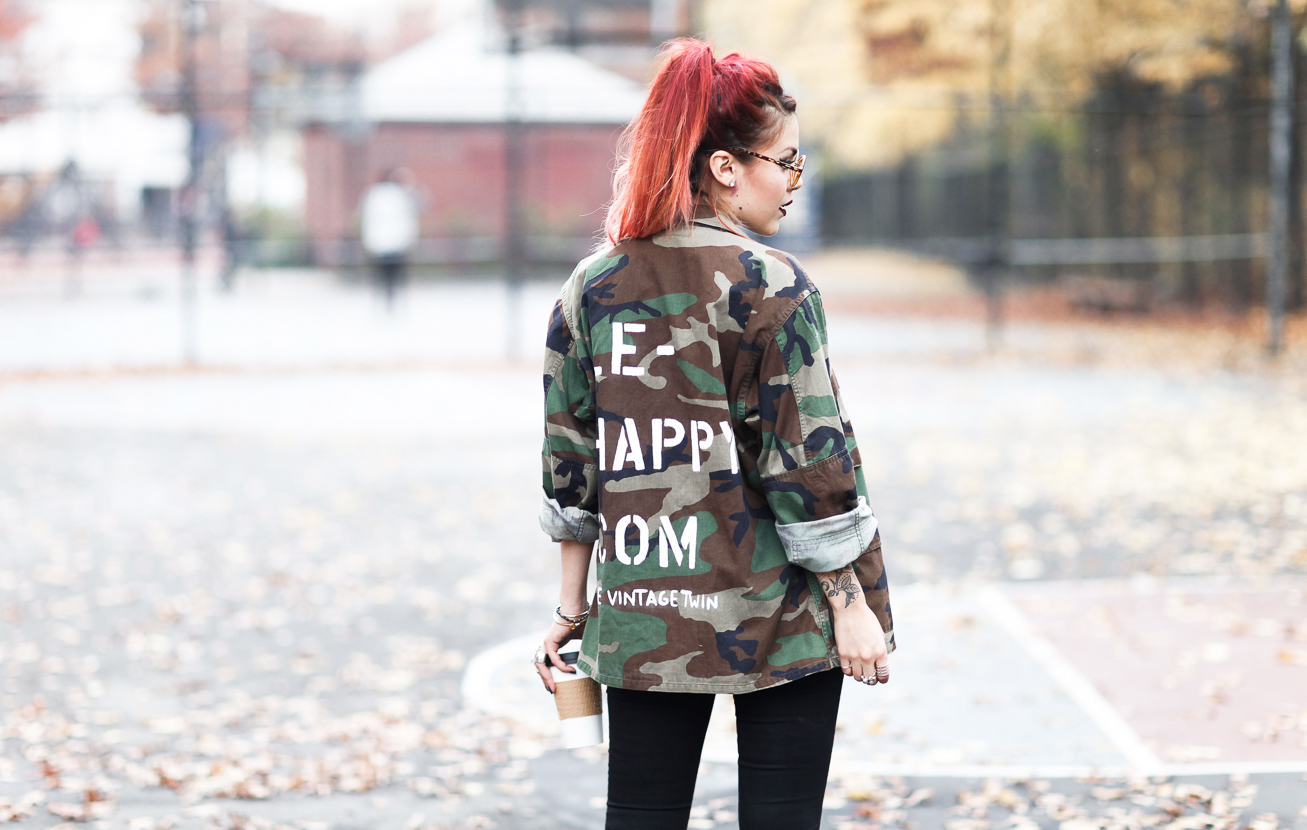 Le Happy wearing army jacket from the Vintage Twin