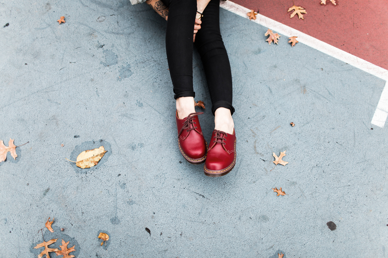 Le Happy wearing red doc martens