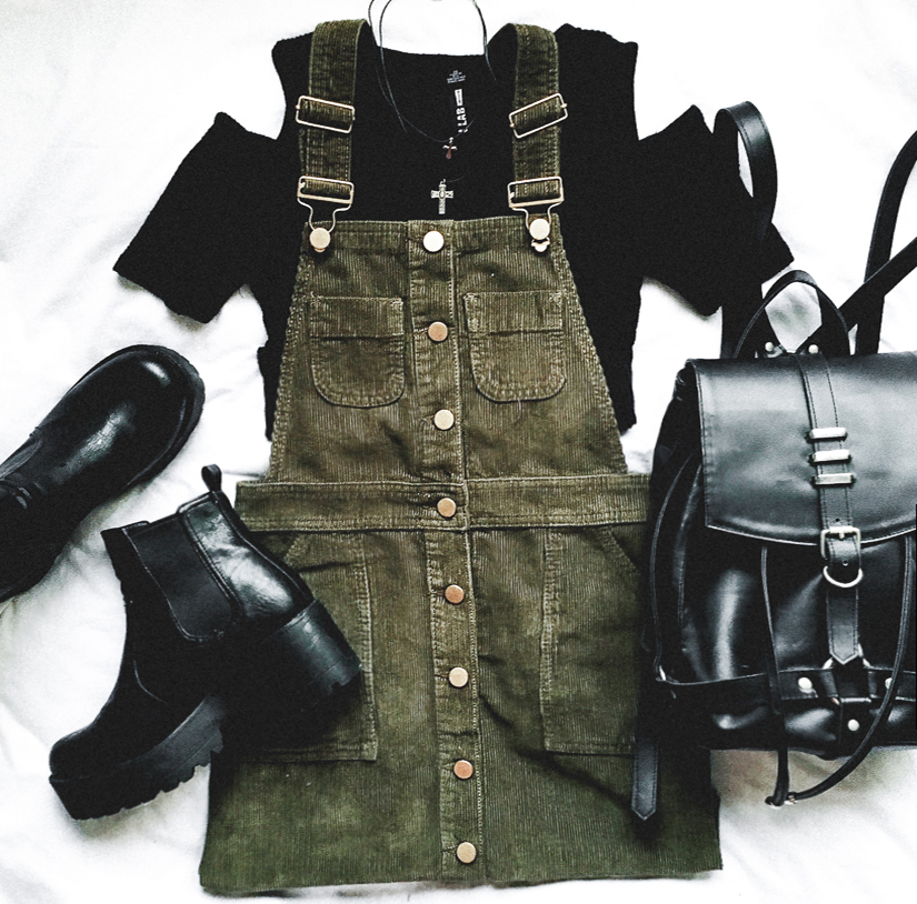Lay flat of dress overalls in green corduroy