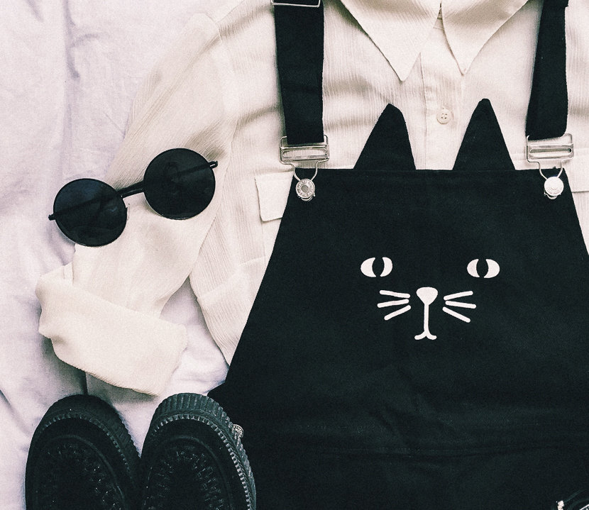 Lay flat of dress overalls with kitty