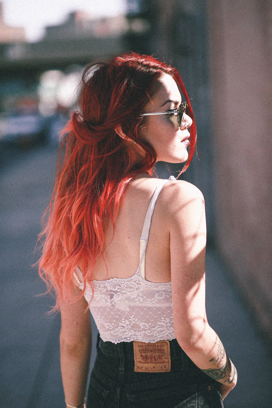 Le Happy wearing white lace bustier