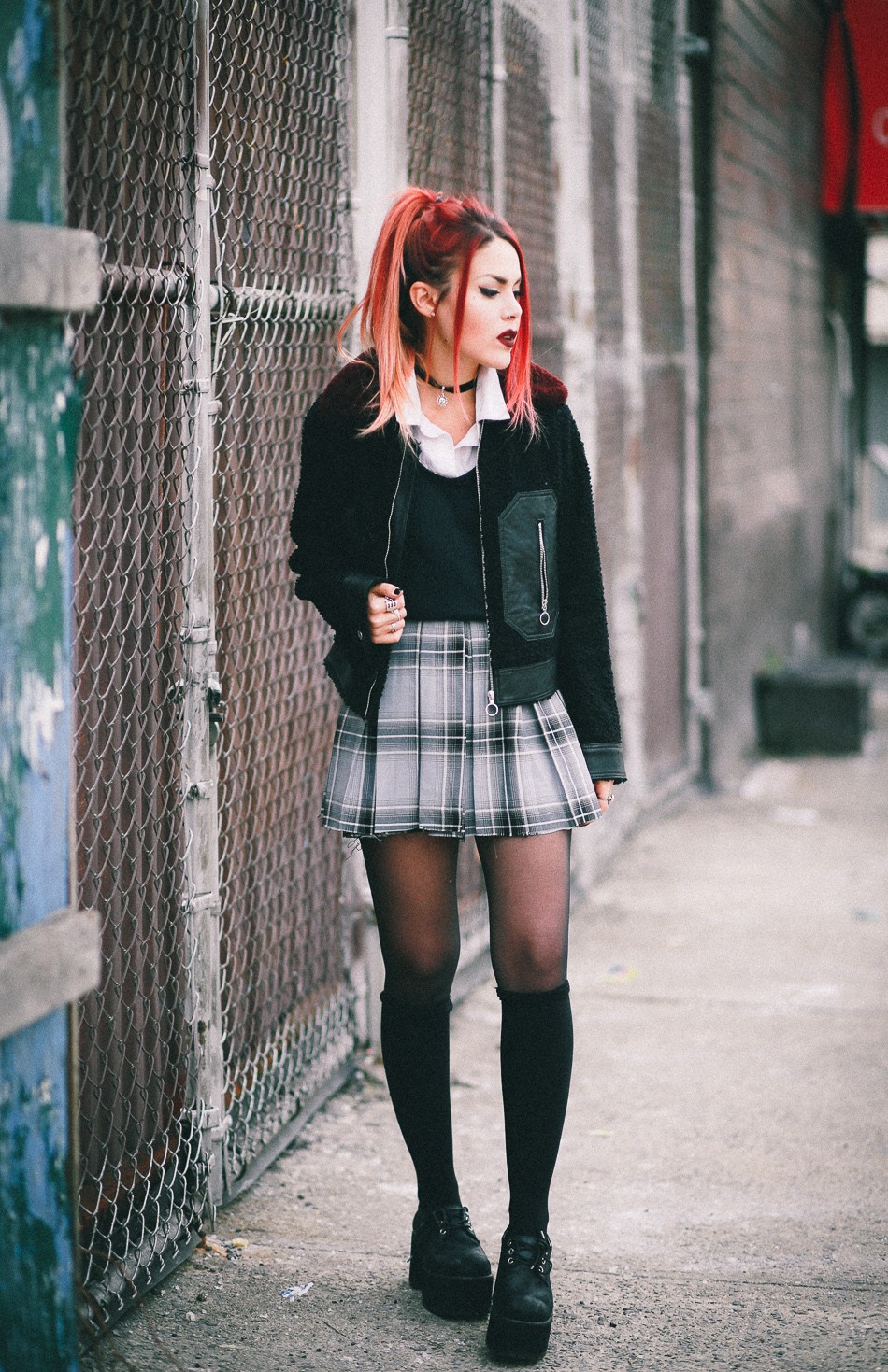 Le Happy wearing Sandro jacket and plaid skirt