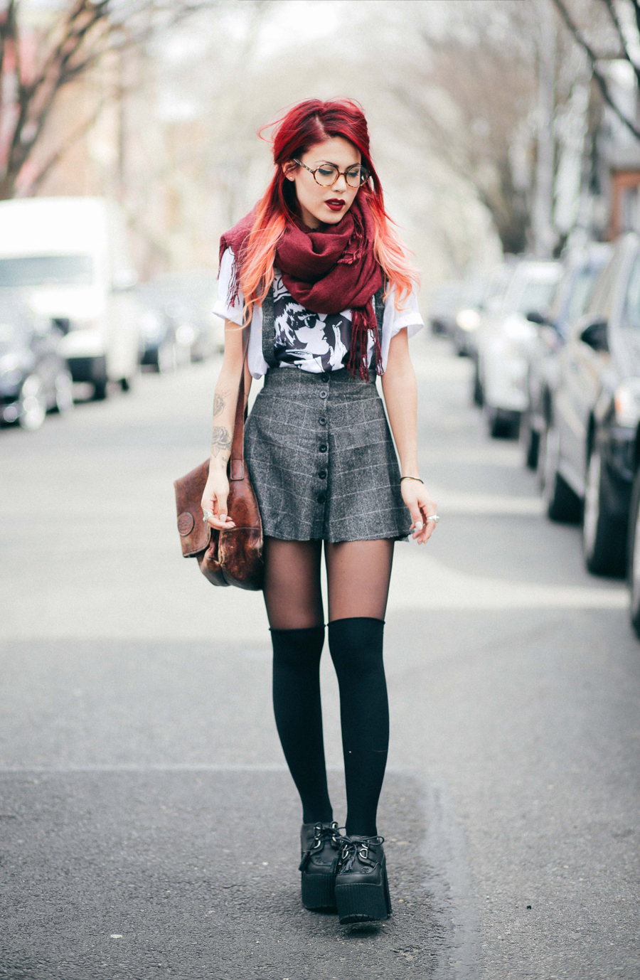 Le Happy wearing Sonic Youth tee and grey plaid skirt