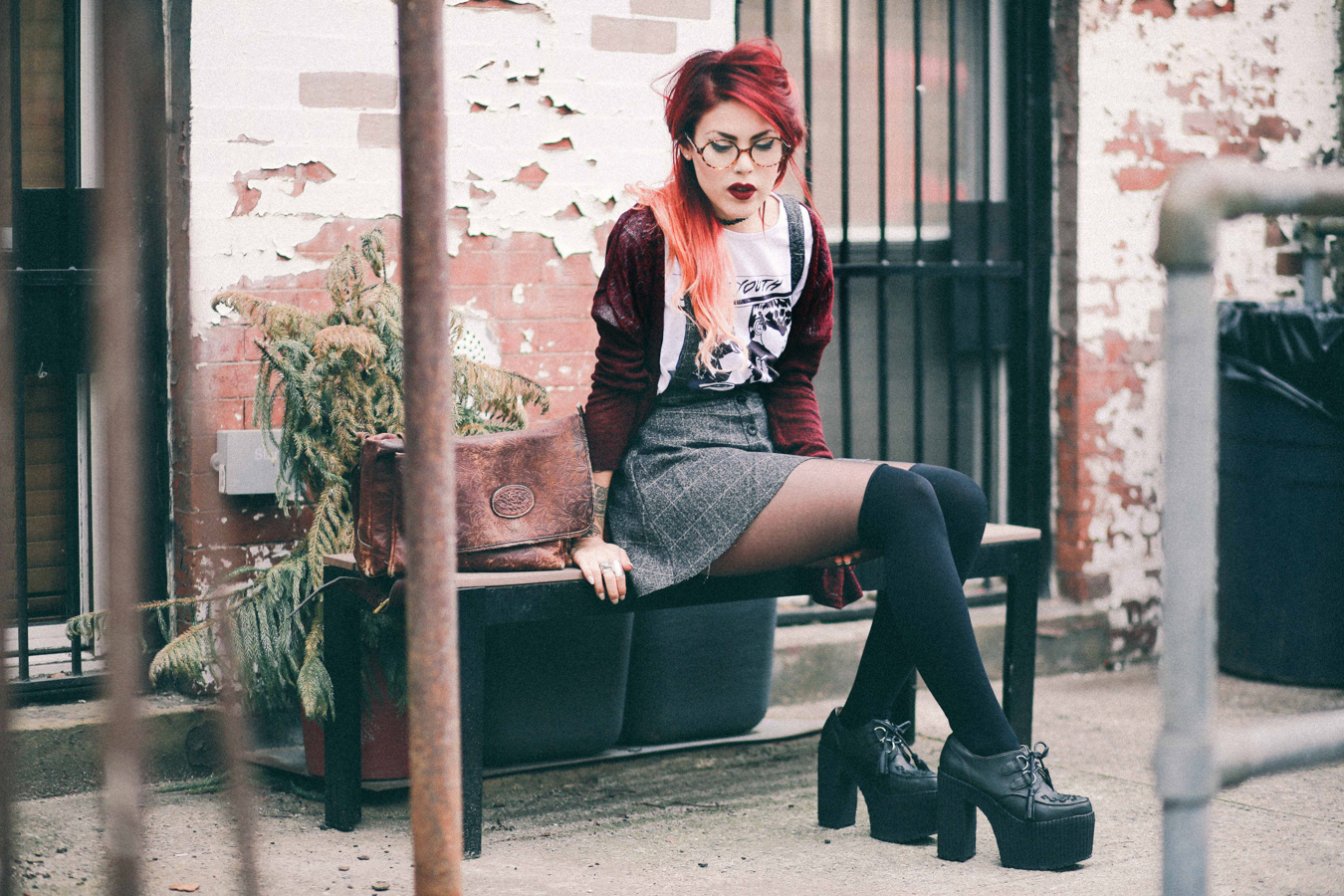 Le Happy wearing Sonic Youth tee and grey mini skirt