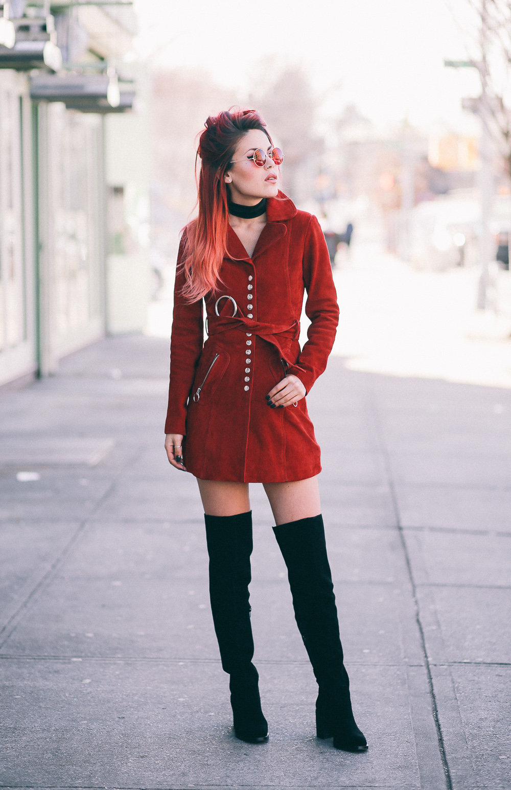 Le Happy wearing thigh high boots and suede coat