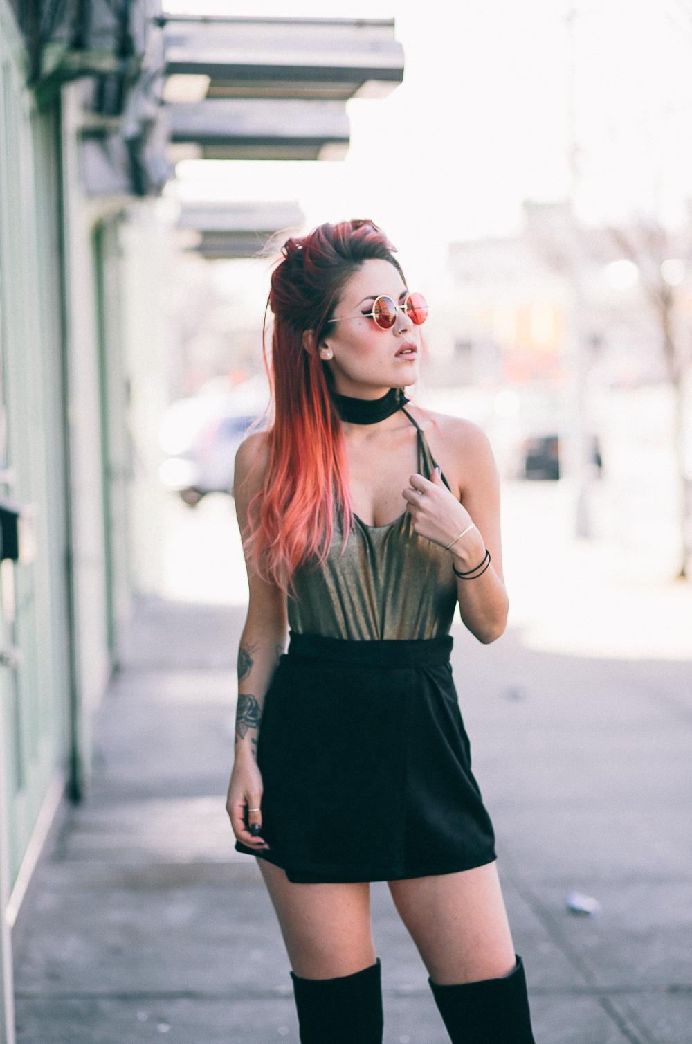 Le Happy wearing metallic bodysuit from Nasty Gal and round sunglasses
