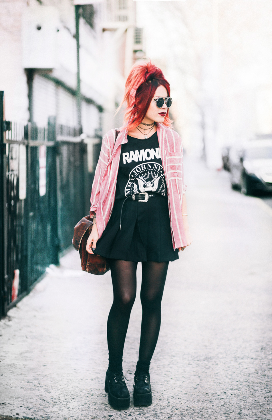 Le Happy wearing Ramones tank and a pleated skirt