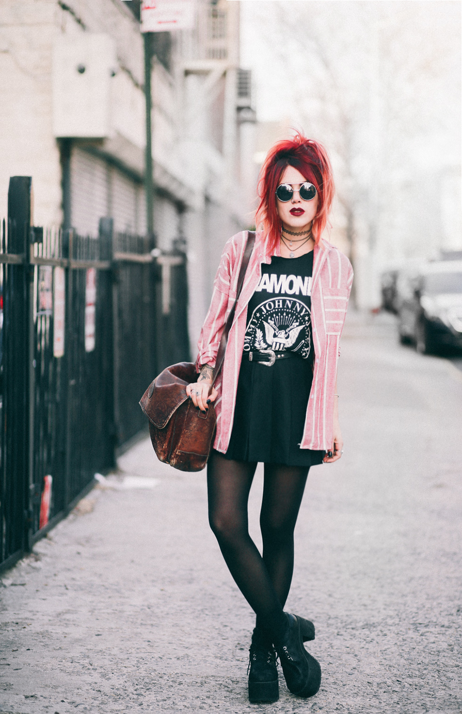 Le Happy wearing Ramones t-shirt and a plaid skirt