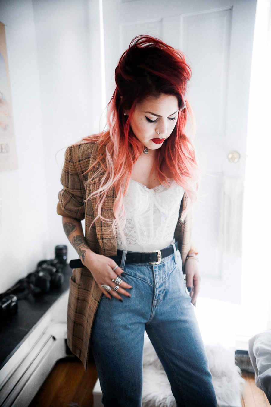 Le Happy wearing mom jeans and vintage lace bustier