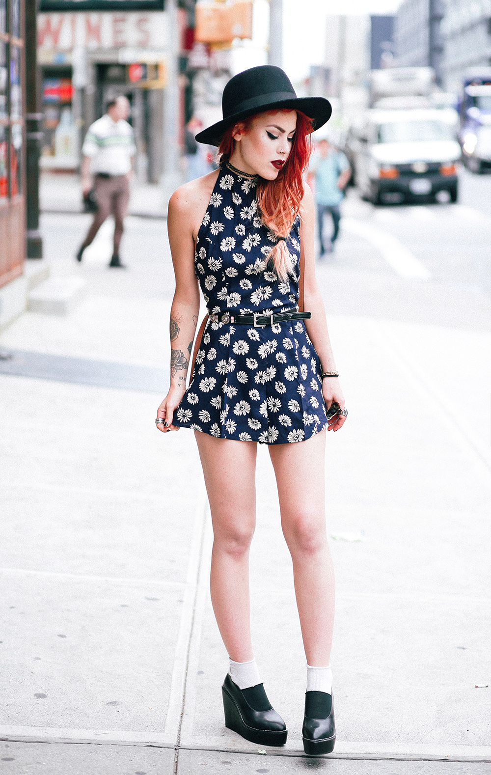 Le Happy wearing floral romper from Asos and a fedora hat