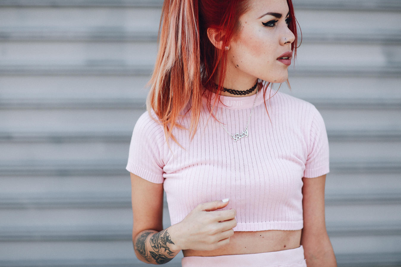 Le Happy wearing a pastel pink unif crop top