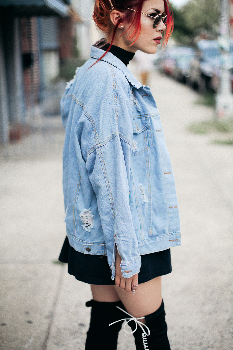 Le Happy wearing McQ thigh high boots and denim jacket