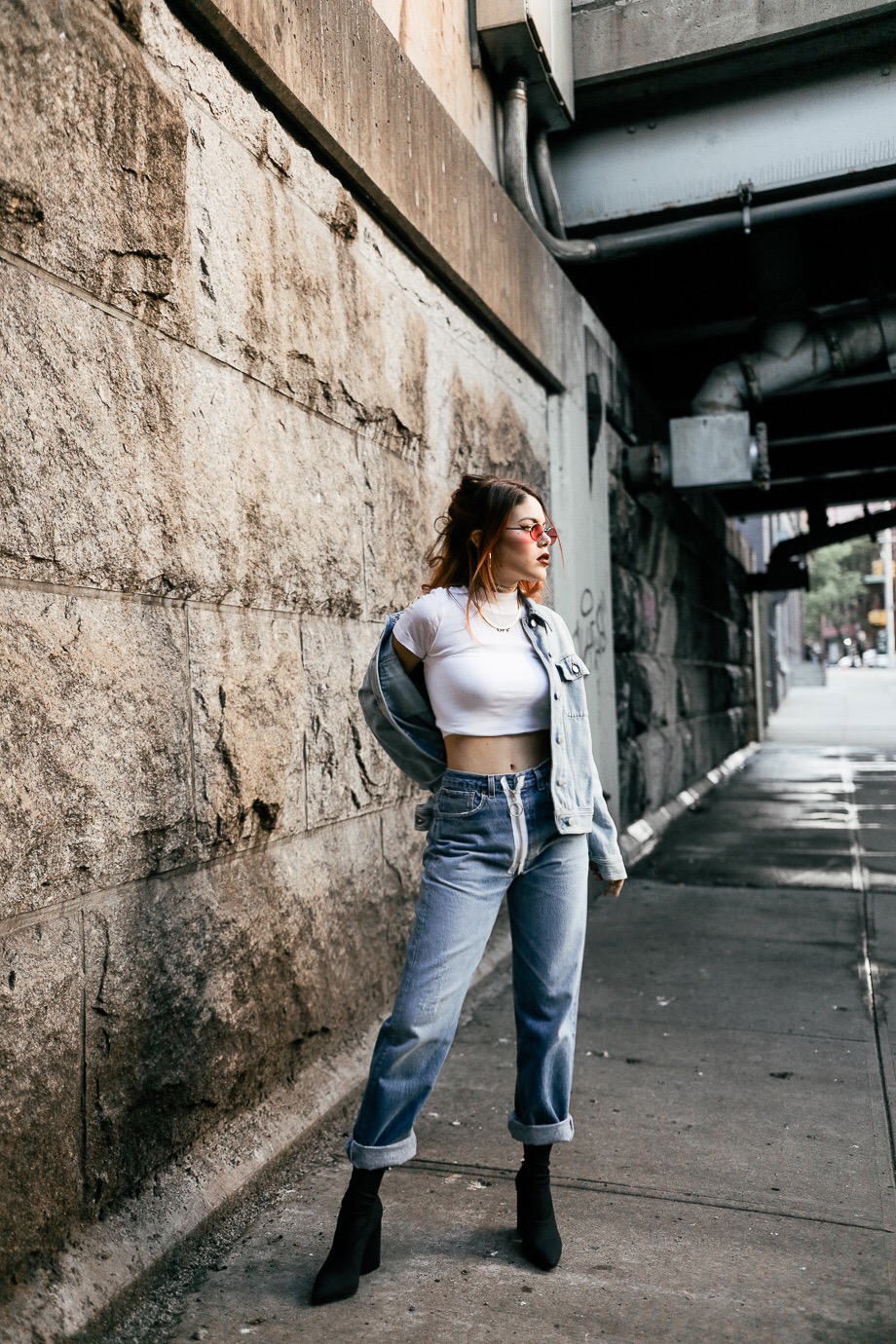 Luanna wearing Off White jeans and MM6 distressed denim jacket with Yeezy boots